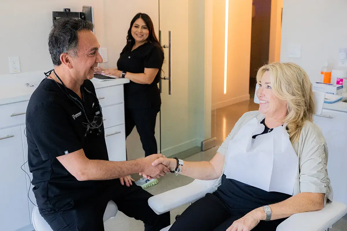 Image of Dr. Ghodsi shaking hands with a patient.